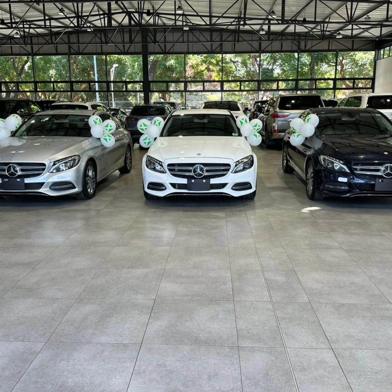 Sir Wicknell blesses Diana Samkange, Mathias Mhere & Andy Muridzo with Mercedes Benz C Classes